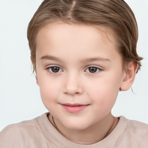 Joyful white child female with short  brown hair and brown eyes