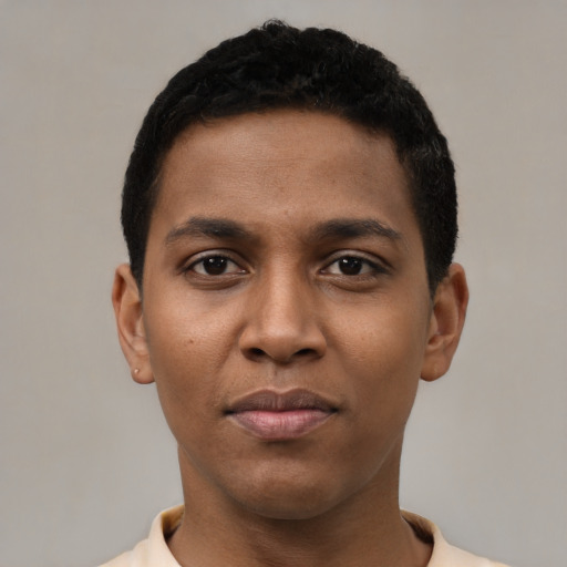 Joyful black young-adult male with short  black hair and brown eyes