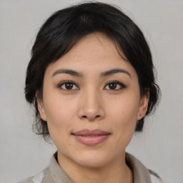 Joyful asian young-adult female with medium  brown hair and brown eyes