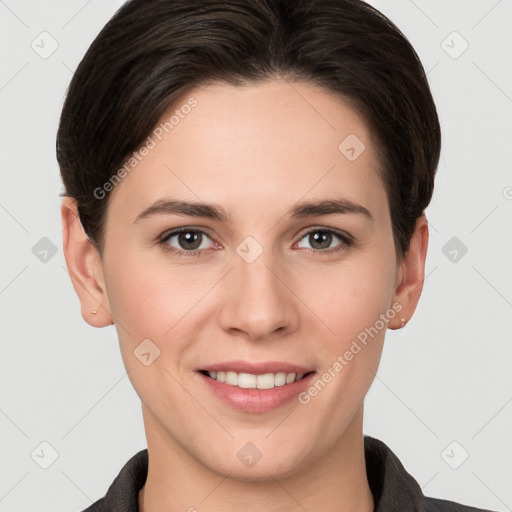 Joyful white young-adult female with short  brown hair and brown eyes