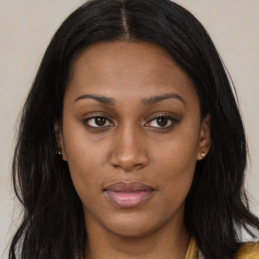 Joyful latino young-adult female with long  brown hair and brown eyes