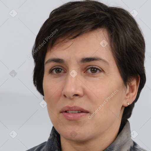 Joyful white adult female with short  brown hair and brown eyes