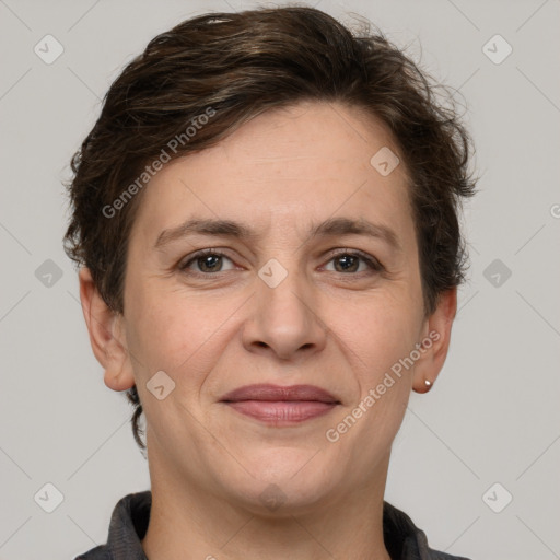 Joyful white adult female with short  brown hair and grey eyes