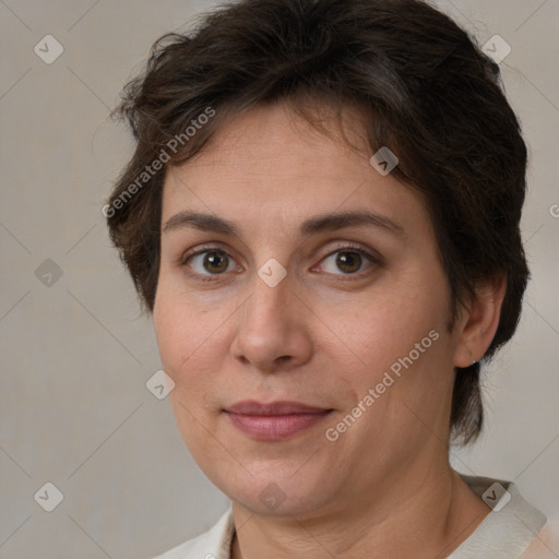 Joyful white adult female with short  brown hair and brown eyes