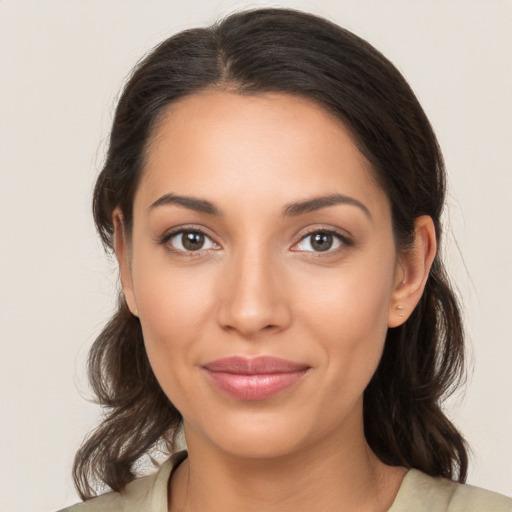 Joyful white young-adult female with medium  brown hair and brown eyes