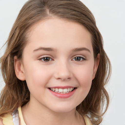 Joyful white child female with medium  brown hair and brown eyes