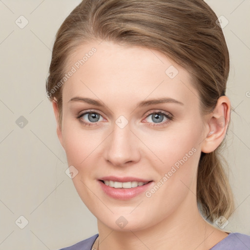 Joyful white young-adult female with medium  brown hair and blue eyes