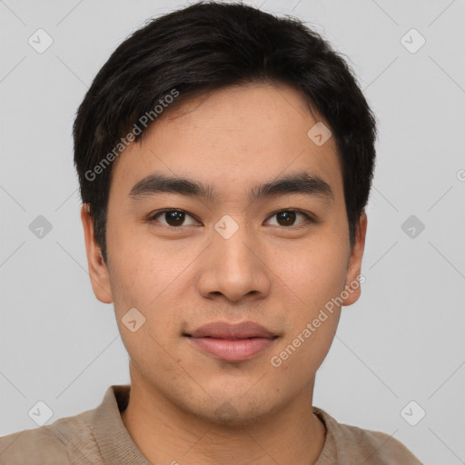 Joyful asian young-adult male with short  black hair and brown eyes