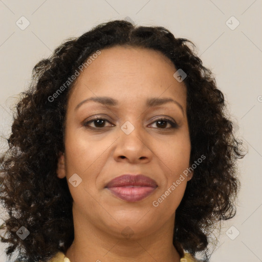 Joyful black adult female with medium  brown hair and brown eyes