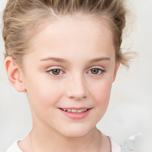 Joyful white child female with short  brown hair and grey eyes