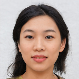 Joyful asian young-adult female with medium  black hair and brown eyes