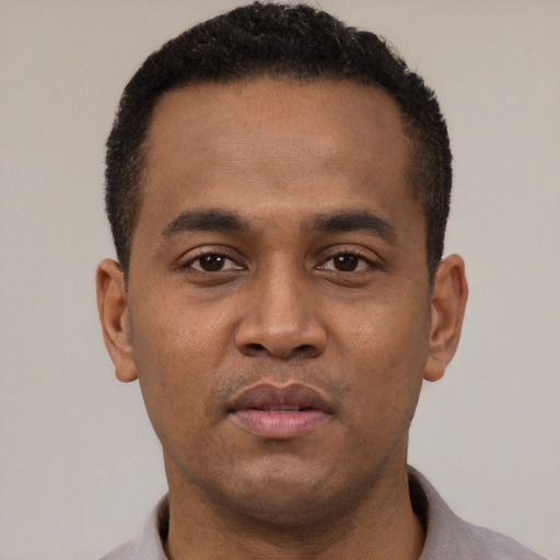 Neutral latino young-adult male with short  black hair and brown eyes