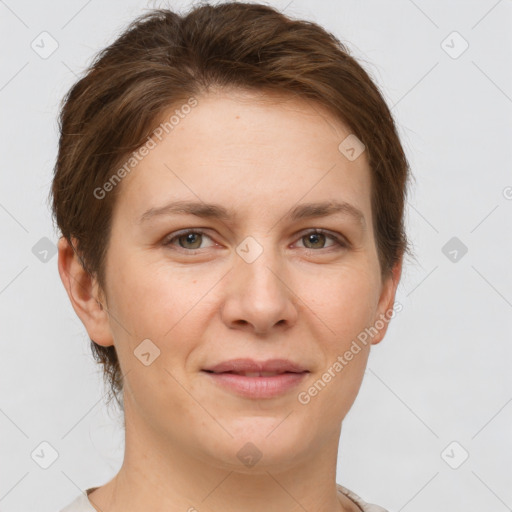 Joyful white young-adult female with short  brown hair and grey eyes