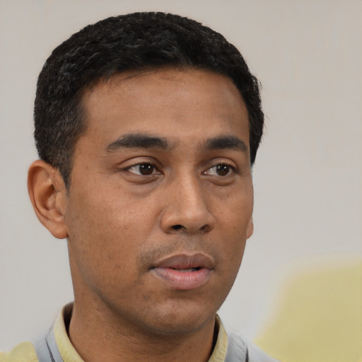 Neutral latino young-adult male with short  black hair and brown eyes