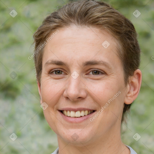 Joyful white adult female with short  brown hair and brown eyes