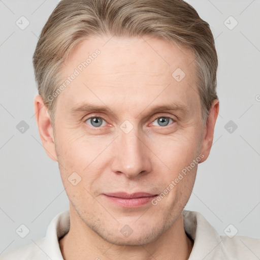 Joyful white adult male with short  brown hair and grey eyes