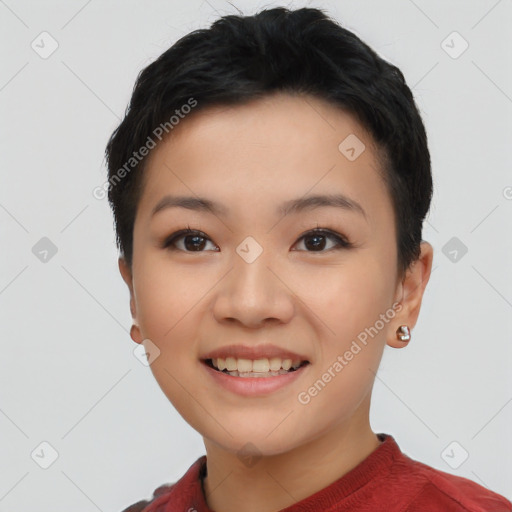 Joyful asian young-adult female with short  black hair and brown eyes