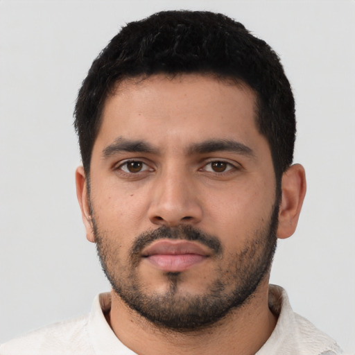 Neutral latino young-adult male with short  black hair and brown eyes