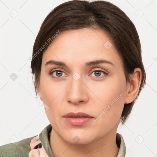 Neutral white young-adult female with medium  brown hair and brown eyes