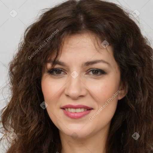 Joyful white adult female with long  brown hair and brown eyes