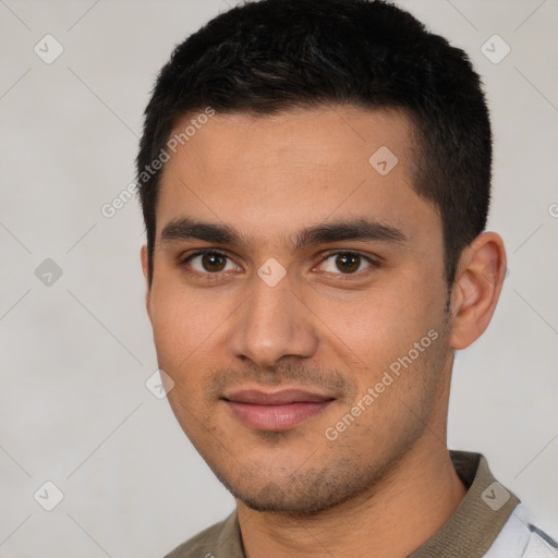 Joyful white young-adult male with short  black hair and brown eyes