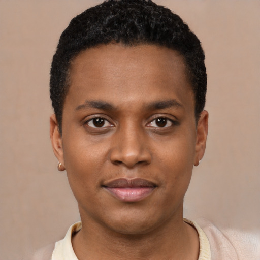 Joyful black young-adult male with short  black hair and brown eyes