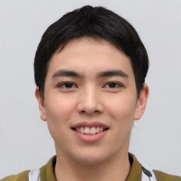 Joyful asian young-adult male with short  black hair and brown eyes