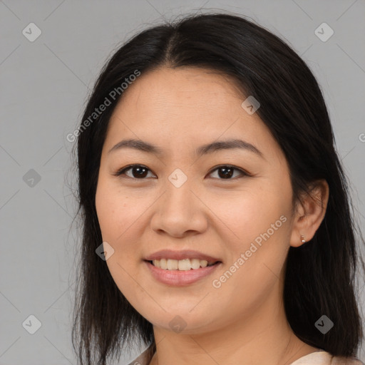 Joyful asian young-adult female with long  brown hair and brown eyes