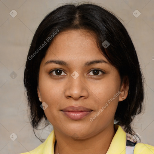 Joyful latino young-adult female with medium  brown hair and brown eyes