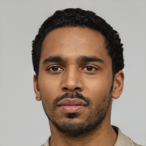 Neutral black young-adult male with short  black hair and brown eyes