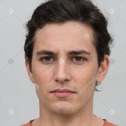 Neutral white young-adult male with short  brown hair and grey eyes