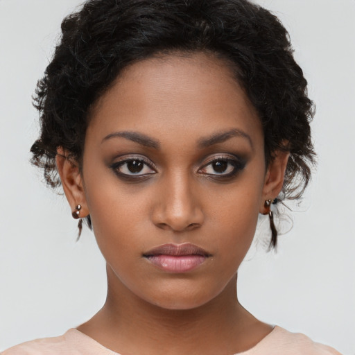 Neutral black young-adult female with medium  brown hair and brown eyes