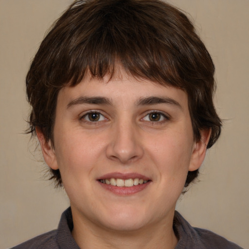 Joyful white young-adult male with medium  brown hair and brown eyes