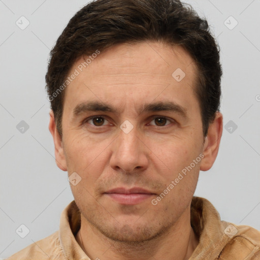 Joyful white adult male with short  brown hair and brown eyes