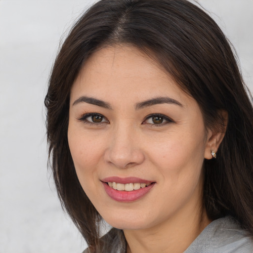 Joyful white young-adult female with medium  brown hair and brown eyes