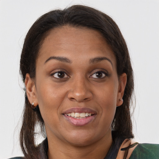 Joyful latino young-adult female with medium  brown hair and brown eyes