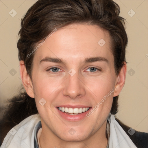 Joyful white young-adult male with medium  brown hair and brown eyes