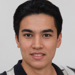 Joyful asian young-adult male with short  black hair and brown eyes