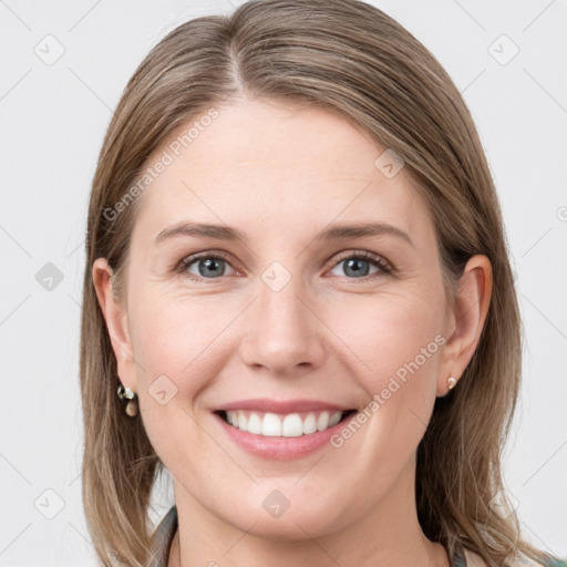 Joyful white young-adult female with long  brown hair and grey eyes