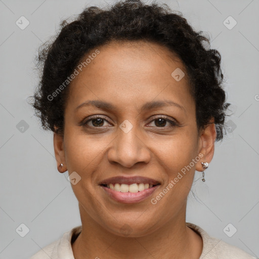 Joyful black adult female with short  brown hair and brown eyes