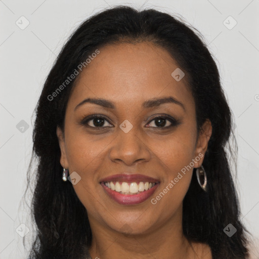 Joyful black young-adult female with long  brown hair and brown eyes