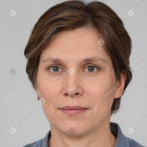 Joyful white adult female with medium  brown hair and grey eyes