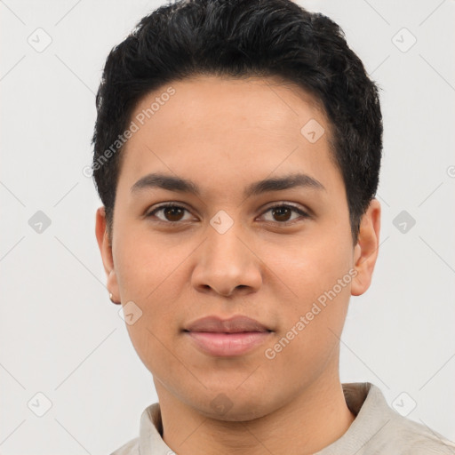 Joyful latino young-adult male with short  black hair and brown eyes