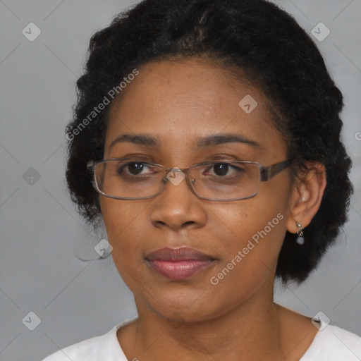 Joyful black adult female with short  brown hair and brown eyes