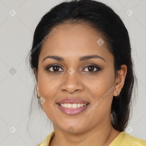 Joyful latino young-adult female with medium  brown hair and brown eyes