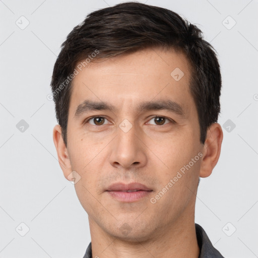 Neutral white young-adult male with short  black hair and brown eyes