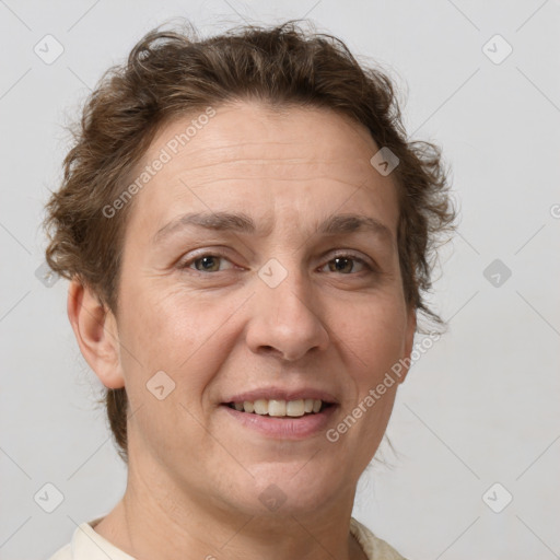 Joyful white adult female with short  brown hair and brown eyes