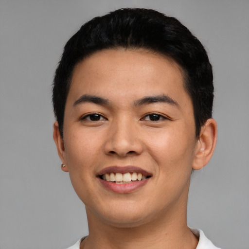 Joyful asian young-adult male with short  black hair and brown eyes