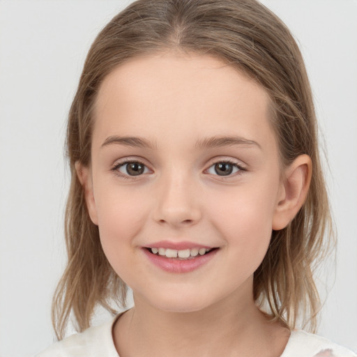 Joyful white child female with medium  brown hair and brown eyes