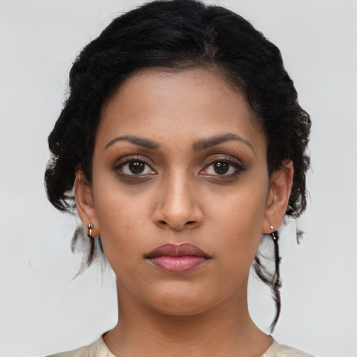 Neutral latino young-adult female with medium  brown hair and brown eyes